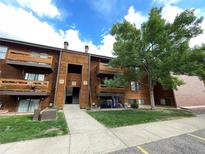 Attractive exterior of a multi-unit building with landscaping and parking at 337 Wright St # 202, Lakewood, CO 80228