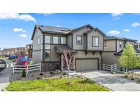 Two story home with attached garage and landscaped yard at 2688 Loon Cir, Castle Rock, CO 80104