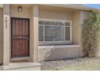 Front door entrance with brickwork and landscaping at 2812 Krameria St, Denver, CO 80207