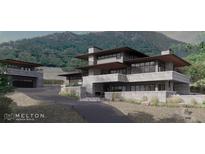 Modern home exterior with stone facade and mountain views at 63 Canyon Pines Dr, Arvada, CO 80403