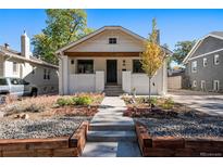 Charming craftsman home with a renovated exterior, landscaping, and walkway at 1420 Dexter St, Denver, CO 80220