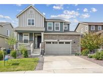 Two-story house with a gray and teal exterior at 26346 E Canal Pl, Aurora, CO 80018