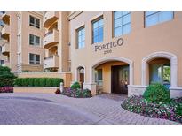 Elegant condo building exterior with landscaping and inviting entrance at 2500 E Cherry Creek South Dr # 414, Denver, CO 80209