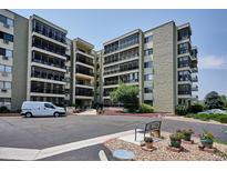 Exterior view of a multi-story condominium building with balconies at 13901 E Marina Dr # 109, Aurora, CO 80014