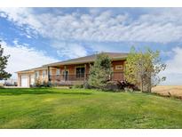 Ranch style home with spacious lawn and deck at 35100 E 120Th Ave, Hudson, CO 80642