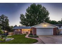 Brick ranch house with a two-car garage at 2745 S Kendall Way, Denver, CO 80227