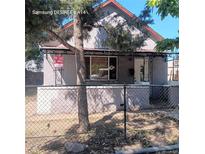 House exterior with chain link fence at 2831 Lawrence St, Denver, CO 80205