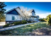 Two-story house exterior with landscaping at 935 Green Gables Cir, Bennett, CO 80102