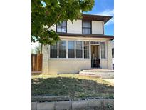Two-story home with a classic design and a front porch at 1053 N Colorado Blvd, Denver, CO 80206