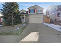 Charming two-story home with a welcoming front entrance and driveway at 5676 S Wenatchee St, Aurora, CO 80015