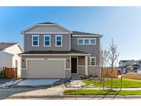 Two-story home with a modern design and attached garage at 4550 Boone Cir, Brighton, CO 80601