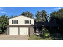 Two-story home with a two-car attached garage at 3006 S Fenton St, Denver, CO 80227