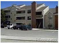 Exterior view of a multi-unit residential building with parking at 12093 W Cross Dr # 308, Littleton, CO 80127