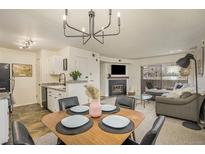 Bright dining area with a mid-century modern table and four chairs at 9510 E Florida Ave # 2052, Denver, CO 80247