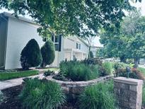 Building exterior showcases landscaping and entrance at 600 S Clinton, Denver, CO 80247