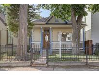 Charming craftsman home with a welcoming porch and well-maintained landscaping at 2733 Champa St, Denver, CO 80205