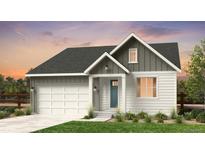 Charming two-story home with a blue front door, white siding, and a two-car garage at 16514 W 93Rd Way, Arvada, CO 80007