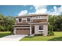 Two-story house with brown siding, stone accents, and a two-car garage at 6993 E 126Th Ave, Thornton, CO 80602