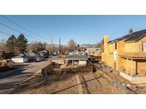 Lot with small cottage and new construction behind at 3001 Chase St, Wheat Ridge, CO 80214