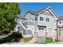 Two-story townhome with attached garage and landscaping at 14300 Waterside Ln # L5, Broomfield, CO 80023