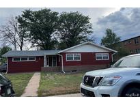 Red brick ranch home with mature trees and landscaping at 3475 S Marion St, Englewood, CO 80113