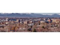 Stunning aerial view showcasing the property's location and mountain backdrop at 460 S Marion Pkwy # 1353, Denver, CO 80209