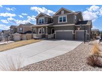 Two-story house with a large driveway and basketball hoop at 19844 Lindenmere Dr, Monument, CO 80132