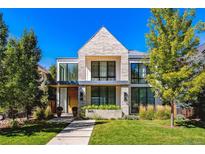 Modern two-story home with stone facade and landscaping at 2475 S Saint Paul St, Denver, CO 80210