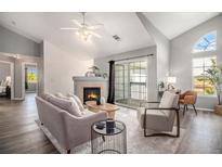 Spacious living room with fireplace and access to balcony at 3231 E 103Rd Pl # 308, Thornton, CO 80229