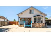 Charming bungalow with stone accents and blue porch at 133 N 9Th Ave, Brighton, CO 80601