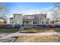 Attractive exterior of a townhome with landscaping and a walkway at 930 Button Rock Dr # J59, Longmont, CO 80504