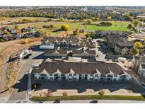 Aerial view of townhomes and community amenities at 18633 Stroh Rd # 1-204, Parker, CO 80134