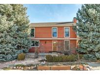 Inviting two-story home with brick exterior and landscaping at 112 W Elm St, Louisville, CO 80027