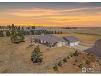 Ranch-style home on acreage with sunset views at 5671 County Road 19, Fort Lupton, CO 80621