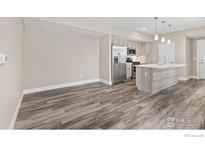 Modern kitchen with stainless steel appliances and an island at 310 S Cherrywood Dr # 101, Lafayette, CO 80026