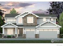Two-story home with stone accents and a three-car garage at 24146 E 35Th Dr, Aurora, CO 80019