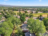 Aerial view of a house with a large backyard, near a park and school at 1055 Edinboro Dr, Boulder, CO 80305