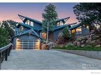 Modern home exterior with unique architecture and driveway at 1145 Timber Ln, Boulder, CO 80304