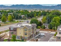 Aerial view of a three-story building with a contemporary design at 310 S Cherrywood Dr # 301, Lafayette, CO 80026