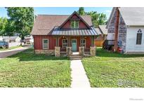 Front view of charming craftsman home at 730 6Th St, Berthoud, CO 80513