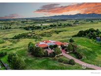 Luxury home with terracotta roof and expansive mountain views at 8758 W Phillips Rd, Boulder, CO 80301