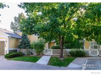 Townhome with a landscaped yard and a private patio at 635 Gooseberry Dr # 1908, Longmont, CO 80503