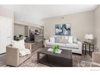 Bright living room with comfortable seating and modern decor at 290 S Cherrywood Dr # 104, Lafayette, CO 80026