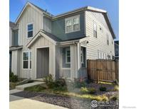 Two-story home with gray and white siding at 1905 Shoshone Pl, Broomfield, CO 80023