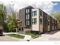 Modern three-story building with light-colored siding and dark wood accents at 1831 22Nd St # 2, Boulder, CO 80302