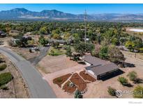 Aerial view of house with mountain views at 1147 Crestmoor Dr, Boulder, CO 80303