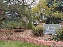 Hunter Creek Condominiums building entrance with landscaping at 4658 White Rock Cir # 5, Boulder, CO 80301
