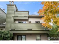 Modern two-story townhome with green siding and private balcony at 3785 Birchwood Dr # 72, Boulder, CO 80304