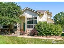 Charming house exterior with landscaping and walkway at 236 Remuda Ln, Lafayette, CO 80026
