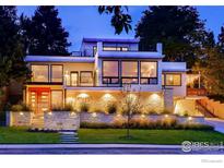 Modern home exterior with stone facade and lighting at 1445 Moss Rock Pl, Boulder, CO 80304